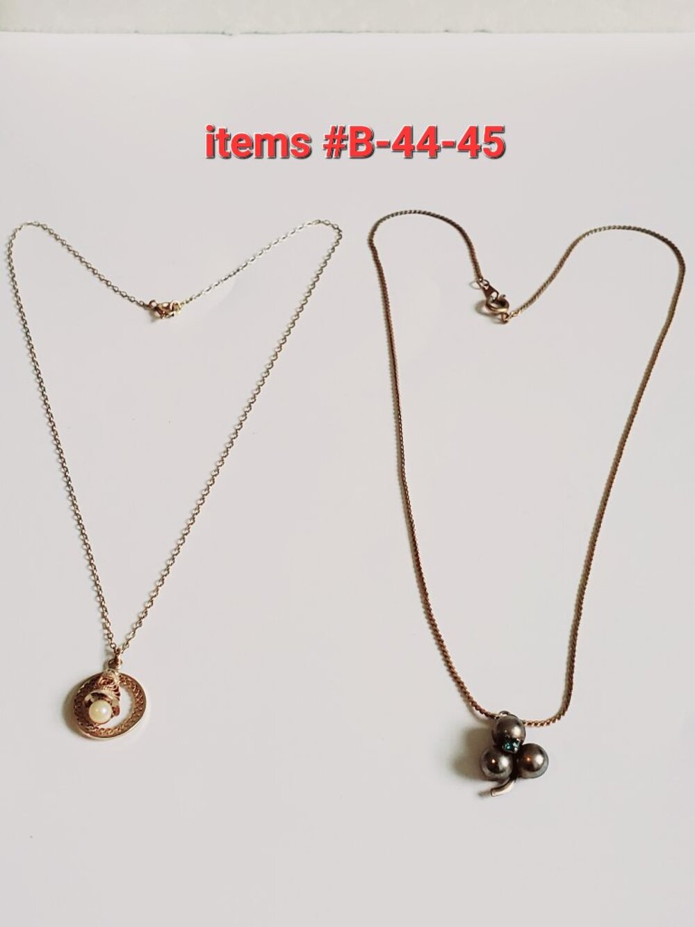 2 Gold Chain Necklaces with small pendants, item# B- 44-45,. wt 7 grams.